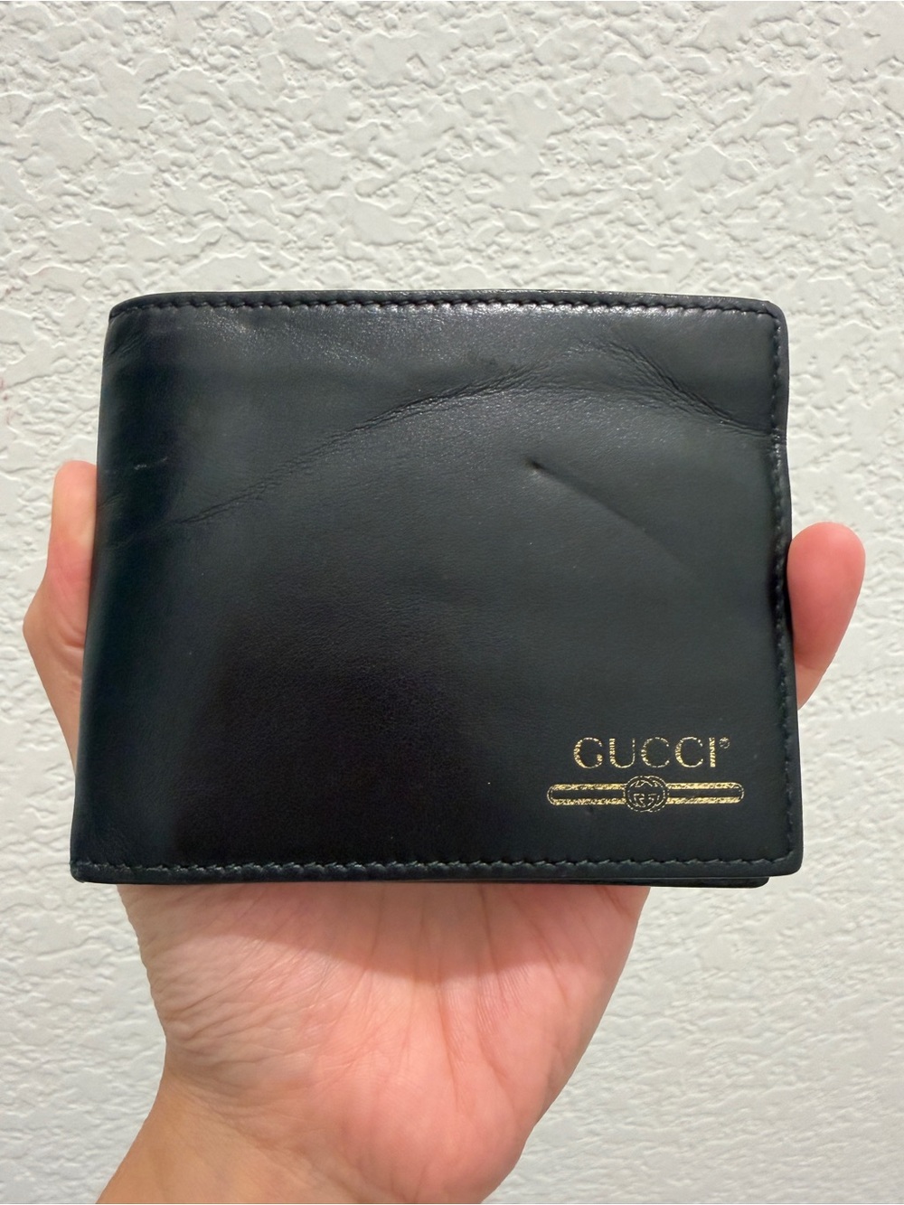 Gucci Black Leather Bi-Fold Wallet with Gold Logo